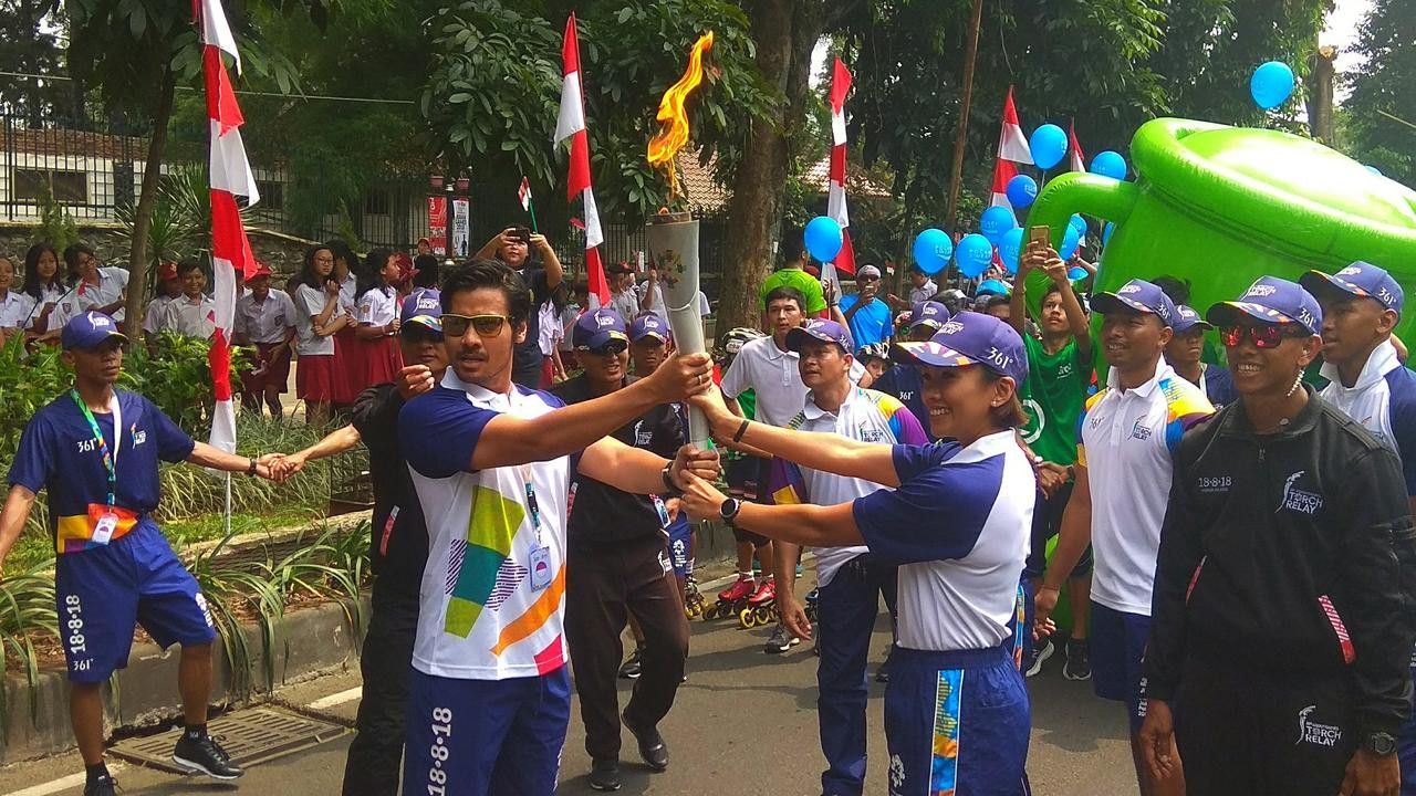 Solusi Atasi Sakit Kepala Saat Ikut Kirab Obor Asian Games